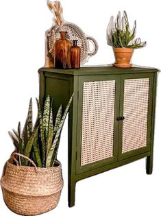 a green cabinet next to a basket with plants