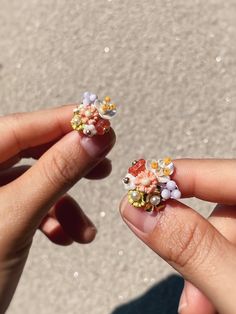 Flower stud earrings, handmade with glass beads, pearl and assorted beads. Inspired by flower arrangements, these small earrings are hand sewn togethet to create intricate bouquets for your ears. Bead Flower Earrings, Bead Flower, Flower Stud Earrings, Earrings Flower, Flower Stud, Floral Jewellery, Flower Earrings Studs, Small Earrings, Flower Studs