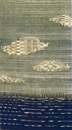 an area rug with two birds on it and one bird flying in the sky over water