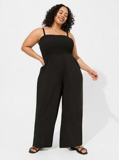 FIT Model is 5'10” wearing size 2. Flowy a-line silhouette. Measures 25” inseam (size 2). MATERIALS + CARE Challis woven fabric: New, improved, and loved by all—and still lightweight, drapey, and (really! ) machine-washable. . Stretch level: None. . 72% viscose, 28% lyocell. Machine wash cold. Line dry. Imported. DETAILS Square neckline. . Removable straps. . Sleeveless. Smocked bodice. Wide leg opening. The best plus size women's a-line maxi jumpsuit jumpsuits in deep black made of washchallis. Crop Vest, Maxi Jumpsuit, Bra And Panty Sets, Deep Black, Wide Leg Jumpsuit, Dress Romper, Jeans Dress, Square Neckline, Smocking