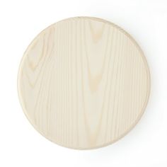 an unfinished wooden plate on a white background