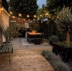 an outdoor patio with lights strung over it