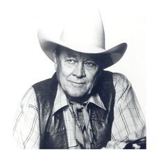 an old photo of a man wearing a cowboy hat