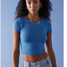 Cap Sleeve Seamless Cami. Perfect For Layering. Length 17 In Everyday Fitted Blue Tops, Fitted Basic Blue Crop Top, Basic Fitted Blue Crop Top, Blue Seamless Trendy Crop Top, Everyday Blue Cropped Top, Seamless Sleeveless Blue Top, Blue Seamless Camisole Top, Blue Seamless Sleeveless Crop Top, Blue V-neck Seamless Camisole