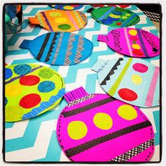 colorful paper plates are arranged on a table