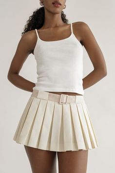 This skirt will be on repeat in your wardrobe. A crisp, fresh take on the micro mini with built in bloomers. You can pair this with practically anything.Features an invisible side zipper and built in fabric covered belt for a pop of color.These perfect pleats stay flat. Low waist skirt that sit below the navel. Hits at the hip for that micro mini length. Skirt grazes your upper thigh.Cotton / Poly blend. Dry Clean Only.Made in New York City. Orseund Iris, Low Waist Skirt, Belted Mini Skirt, Micro Mini Skirt, Cardigan Sweater Jacket, Micro Mini, Crop Top Blouse, Boho Maxi Dress, On Repeat