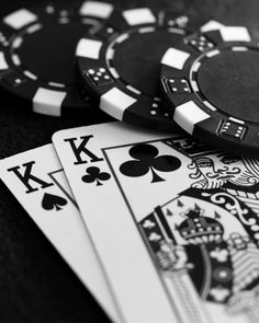 poker chips and playing cards on a table