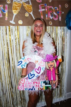 a woman in a pink dress holding up a sign