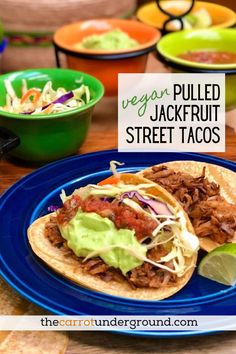 shredded chicken tacos with jackfruit on a blue plate