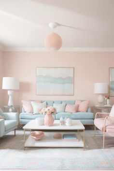 a living room with pastel colors and furniture on the floor, including couches