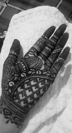 a person's hand with henna on it