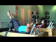 a man and woman doing exercises in a gym