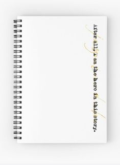 a spiral notebook with gold lettering on it