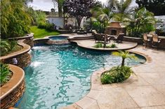 an outdoor swimming pool surrounded by trees and plants in the middle of a backyard area