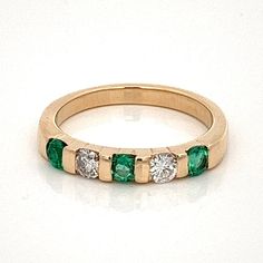 Emerald and Diamonds 14k Yellow Gold Wedding Band / Stack Band Ring- Size 5.5-  Stacking Stackable  ET1071 This ring features a captivating combination of emeralds and diamonds and is sure to catch everyone's attention. The lush green emeralds, known as the birthstone of May, symbolize love, prosperity, and harmony. Each emerald is carefully handset, creating a beautiful contrast against the shimmering diamonds. The diamonds, with their timeless sparkle, add a touch of brilliance and elegance to the overall design. Perfect for stacking with other rings or wearing on its own, this versatile piece is ideal for everyday wear or special occasions. With its impeccable craftsmanship and stunning gemstone arrangement, this 14k yellow gold stack band ring is a true testament to your unique style a Green Diamond Stackable Rings Fine Jewelry, Classic Green Diamond Stackable Ring, Luxury Yellow Gold Stackable Emerald Ring, Luxury Gold Emerald Stackable Ring, Fine Jewelry Green Emerald-cut Stackable Rings, Stacked Wedding Bands, Emerald Gem, Yellow Gold Wedding Band, Gold Wedding Band