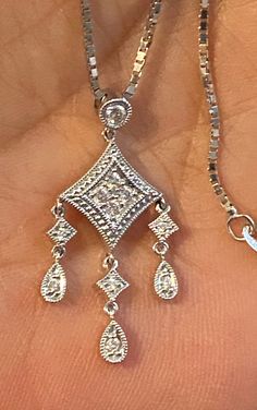 "Solid 14K White Gold Diamond Pendant Necklace 18\" My ex purchased this for me from a jeweler in NYC and it was EXPENSIVE!! STUNNING diamond pendant crafted beautifully in 14k White gold and genuine diamonds! The pendant measures approximately 1 1/4 long x 1/2\" wide. Chain is a nice weight box chain, 18\" long. 4.6 grams total weight. GREAT DEAL!! Please message me with any questions Shipped insured/delivery confirmation I guarantee item to be exactly as described and pictured." Diamond-shaped Diamond Necklace For Anniversary, White Gold Dangle Diamond Necklace Gift, Exquisite Sterling Silver Diamond Cut Necklace, Dazzling Dangle Jewelry With Single Cut Diamonds, Elegant Diamond Dangle Necklace For Anniversary, Elegant Dangle Diamond Necklace For Anniversary, Fine Jewelry Diamond Dangle Necklace As Gift, Fine Jewelry Diamond Necklace With Dangle For Gift, Fine Jewelry Diamond Dangle Necklace For Gift