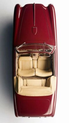 an overhead view of a red car with two seats