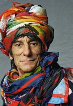 a man wearing a colorful hat and scarf