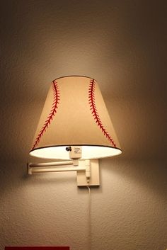 a baseball lamp is lit up on the wall