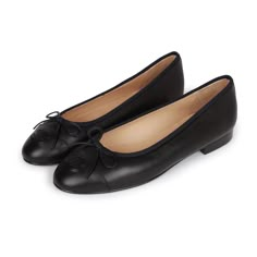 This pair of CC Ballet flats are in dark navy blue lambskin, with an embossed "CC" logo toe cap, tie front, tonal stitching, and black leather soles. Origin: ItalyCondition: New and never wornAccompanied by: Damaged Chanel box, Two shoe dustbagsSize: 37 EU Classic Navy Leather Shoes With Leather Sole, Black Chanel Flats, Chanel Shoes Black, Chanel Flats, Jewelry Gift Guide, Chanel Box, Fame Dr, Black Ballet Flats, Dark Navy Blue