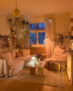 a living room filled with furniture and plants