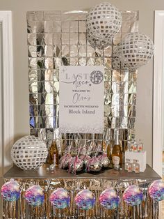 a table topped with lots of disco balls