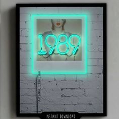 a neon sign with the word 1989 on it in front of a white brick wall