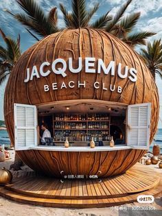 a large wooden ball with the words jaquemus beach club on it's side