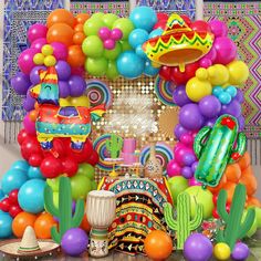 a mexican themed birthday party with balloons and decorations