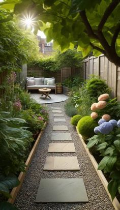 a garden with lots of green plants and flowers on the side of the path, surrounded by greenery