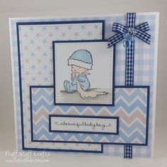 a blue and white card with a baby on it