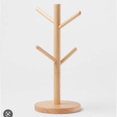 a wooden stand with three trees on it