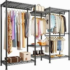 an organized closet with clothes hanging on racks and boxes in front of the rack,