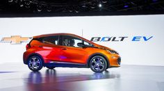 the chevrolet bolt ev concept car is on display at an auto show in new york