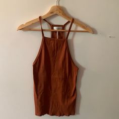 Out From Under Ribbed Tank Top A Burnt Orange/Brown/ Red Color. Small Bought From Urban Outfitters Great Condition, Never Worn Casual. Contemporary. Ripped. Unique. Party. Nightlife. Artsy. Vintage. Retro Smoke Free Household Bundle For Great Deals And Savings On Shipping Brown Cami Top For Spring, Brown Stretch Halter Top For Spring, Stretch Brown Halter Top For Spring, Brown Sleeveless Halter Top For Spring, Fitted Brown Tank Top For Day Out, Urban Outfitters Brown Crop Top For Spring, Summer Brown Cami Top, Fitted Orange Tank Top For Day Out, Fitted Brown Tops For Summer