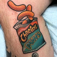 a close up of a person's leg with a tattoo on it that says cheetos