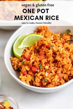 one pot mexican rice in a bowl with lime wedges next to it and the recipe title