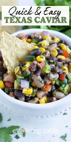 a white bowl filled with black eyed peas and corn salsa