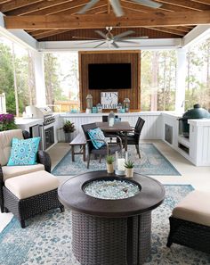 an outdoor living area with furniture and decor