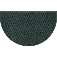 a green door mat with an oval design on the front and bottom, which is shaped like a diamond pattern