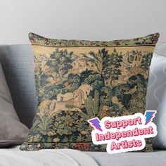 a pillow with the words support independent artists on it and an image of horses in a forest