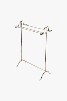 a metal rack with two hooks on it