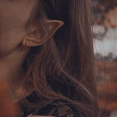 a close up of a woman's face and neck