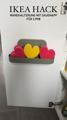 two heart shaped sponges are placed on a shelf in a store's display