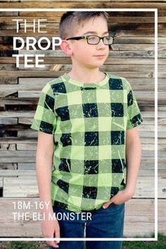 a young boy wearing glasses standing in front of a wooden fence with the text, the drop tee 18m - 16y monster