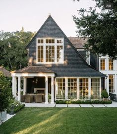 a large house with lots of windows and white trim