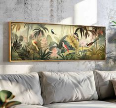 a painting hanging on the wall above a couch