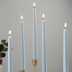 a group of lit candles sitting on top of a table