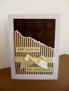 a chocolate card with a bow on the front and words keep calm and eat chocolate