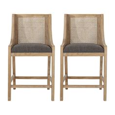 a pair of wooden chairs with grey upholstered back and seat cushions on white background